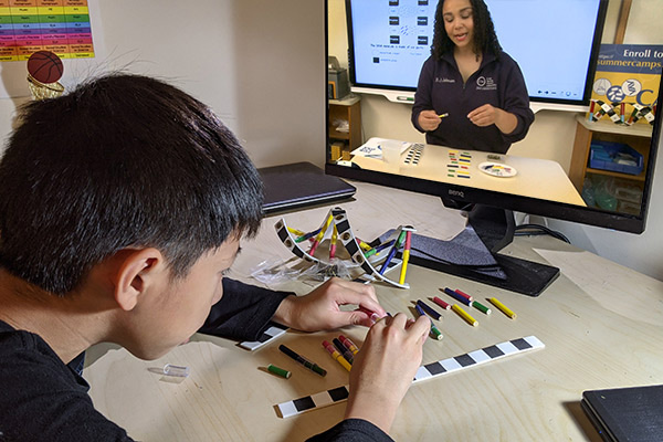 Student building a DNA model from home